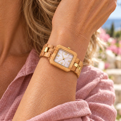 Woman in a pink linen shirt wearing The Pink Pearl slim wood watch