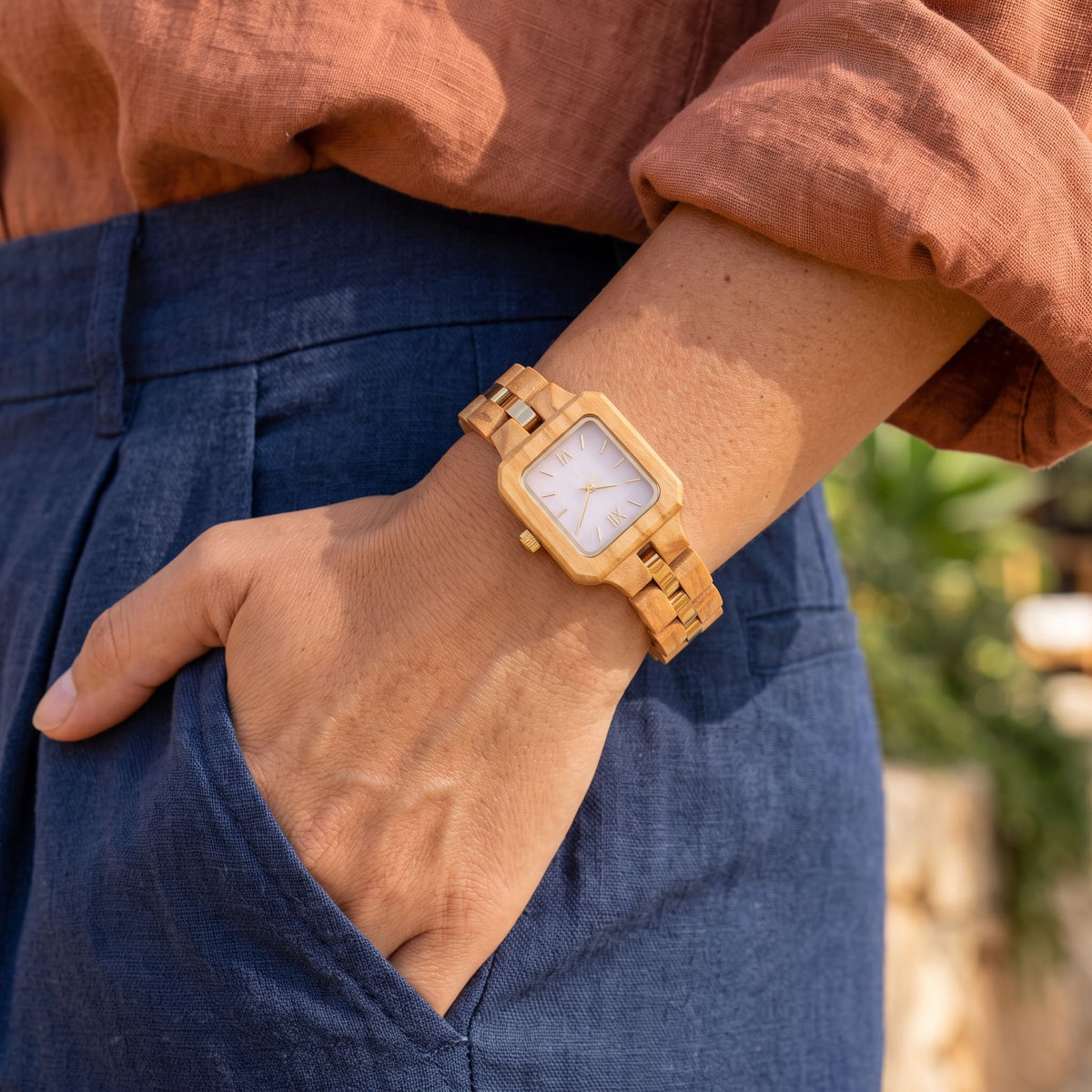 The Pink Pearl lightweight women's dress watch worn with denim, hand in pocket
