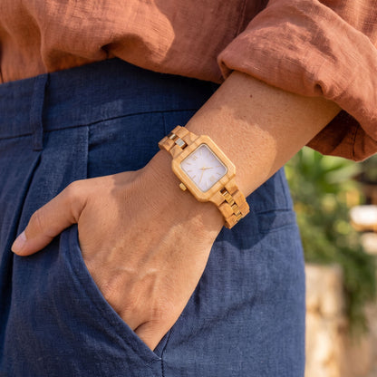The Pink Pearl lightweight women's dress watch worn with denim, hand in pocket