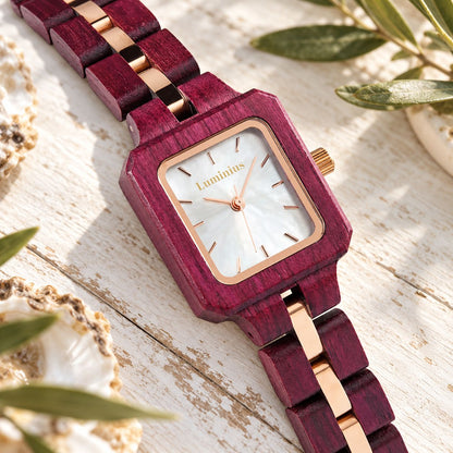 The Rosewood Purpleheart wood watch at an angle, showing the timber and gold-tinted link band